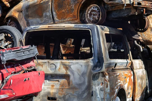 Auto in Irpen. Kyiv region, Ukraine. Russia Ukraine war. Cemetery of cars in Irpin, the consequences of the invasion of the Russian army in Ukraine. Destroyed cars of the civilian population