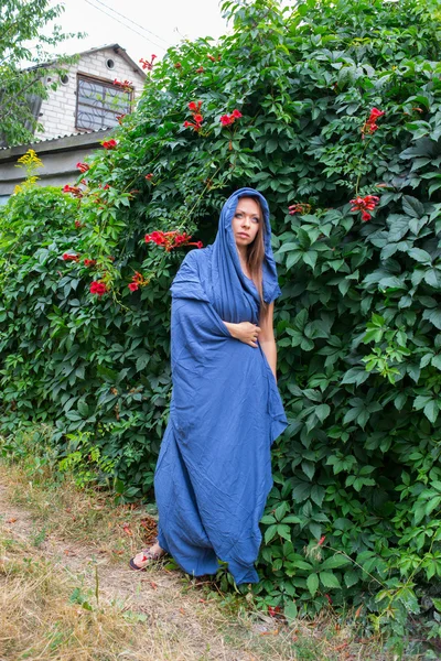 Girl in a blue cloak — Stock Photo, Image