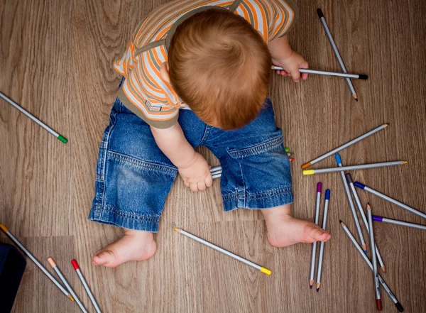 Baby with colorful pencils — Stock Photo, Image
