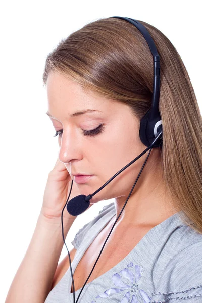 Young woman talking on headset — Stock Photo, Image