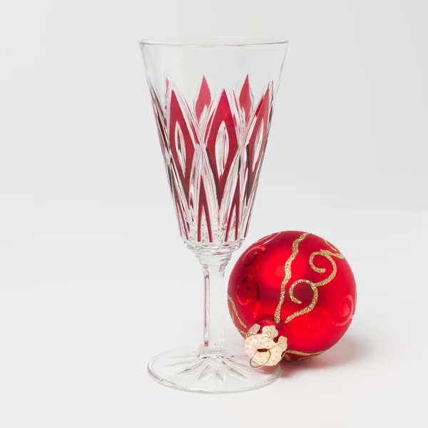 Empty glass and christmas ball — Stock Photo, Image