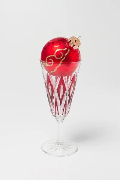 Empty glass and christmas ball — Stock Photo, Image