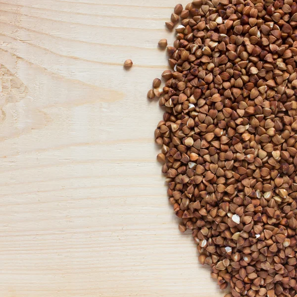 Buckwheat on wood — Stock Photo, Image