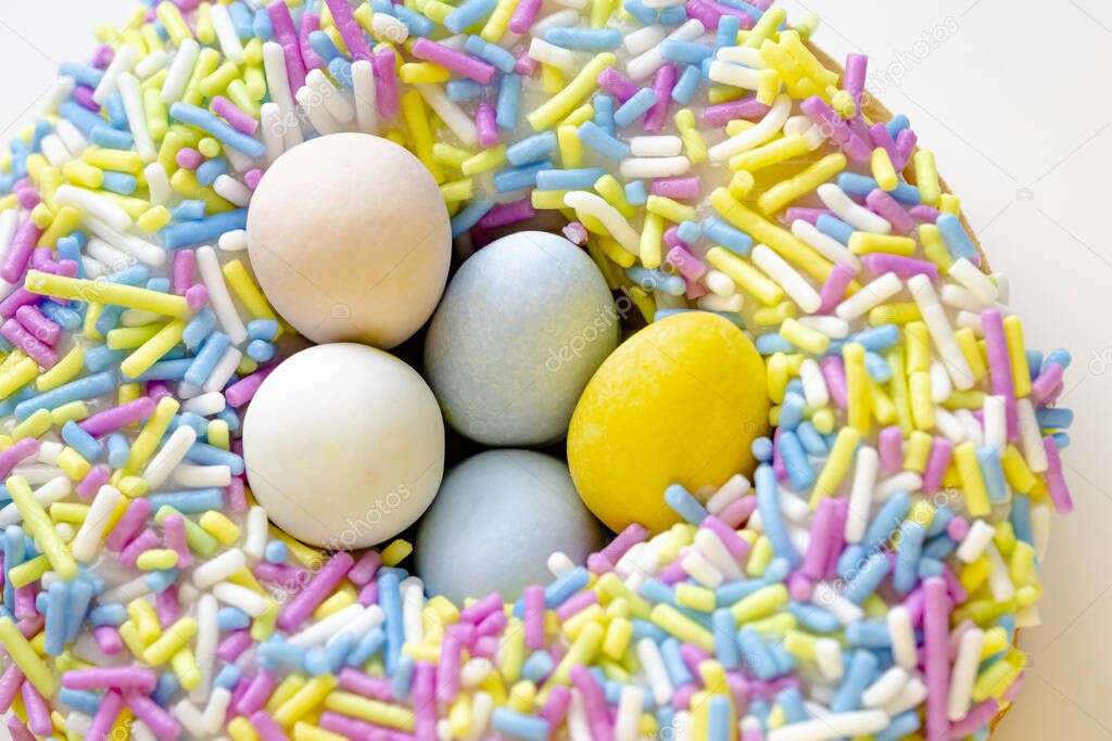 A close up of a Easter Nest Dream Donut with Eggies