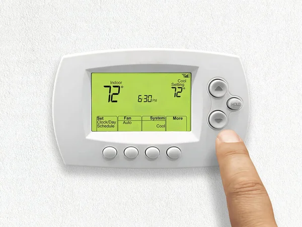 Person Using Digital Thermostat — 图库照片