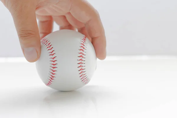 Person Holding Baseball White Background Table — Stok Foto