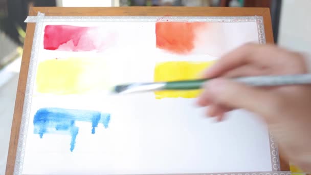 Girl making swatch of cobalt blue color paint — Stock Video