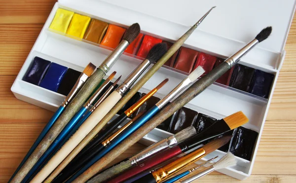 Paint brushes and watercolor. Stock Image