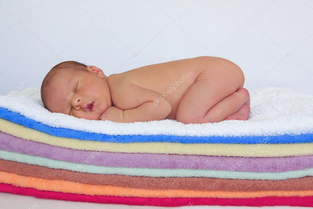 Baby boy, sleeping on towels Stock Photo by ©t.tomsickova 32465549