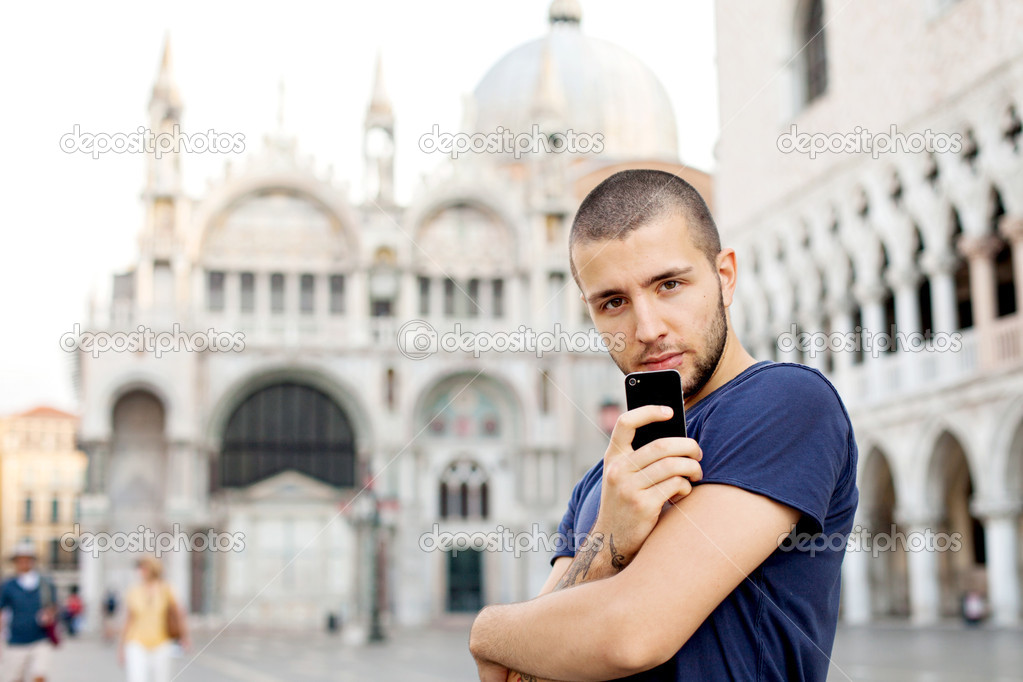 Portrait of a boy, holding phone