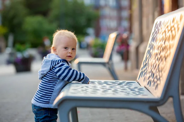 Cute Baby Boy Standing Next Bench Beautiful Town Sunset — Stock Photo, Image