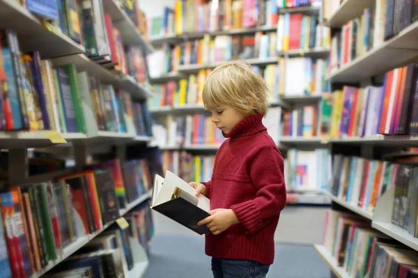 Cute Blond Toddler Child Boy Reading Book Book Store Wintertime — Stock Photo, Image