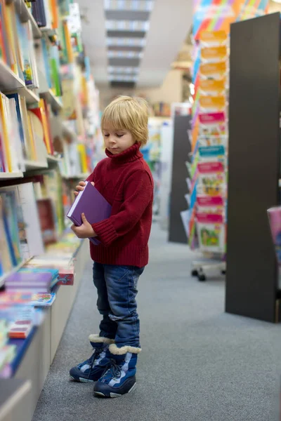 Cute Blond Toddler Child Boy Reading Book Book Store Wintertime — 图库照片