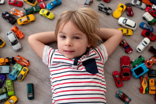 Cute Toddler Child Blond Boy Playing Colofrul Cars Different Sizes — Stock Photo, Image