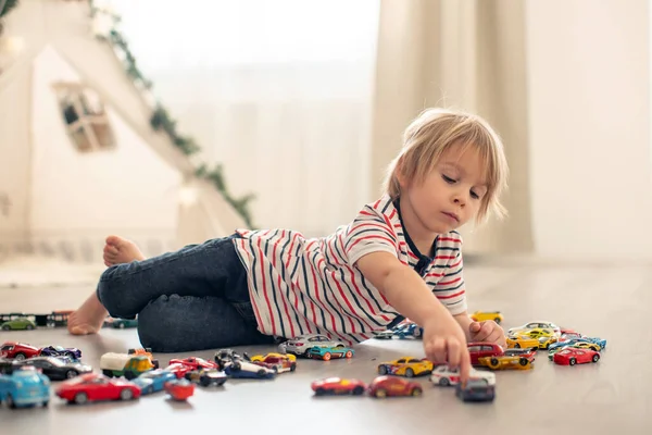 Cute Toddler Child Blond Boy Playing Colofrul Cars Different Sizes — Stock Photo, Image