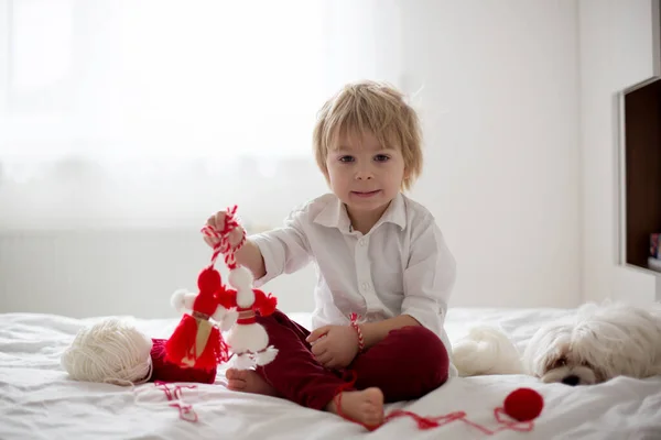 Cute Child Blond Boy Playing White Red Bracelet Called Martenitsa — Stock Photo, Image