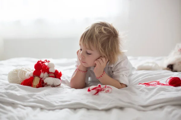 Cute Child Blond Boy Playing White Red Bracelet Called Martenitsa — Stock Photo, Image