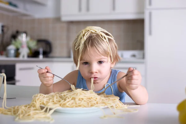 Little Blond Boy Toddler Child Eating Spaghetti Lunch Making Mess Stock Picture