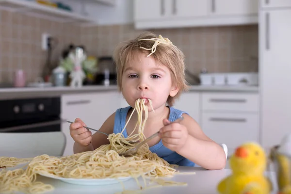 Little Blond Boy Toddler Child Eating Spaghetti Lunch Making Mess Stock Image