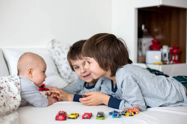 Three Children Baby His Older Brothers Bed Morning Playing Together — Stock Photo, Image