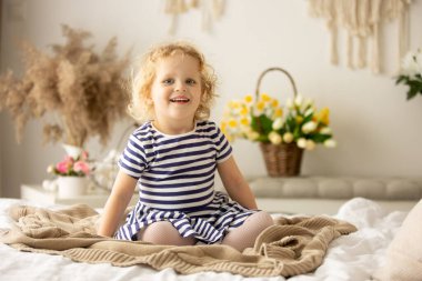 Happy children, siblings, enjoying Easter holiday together, tradition with handmade twig, braided whip made from pussy willow, traditional symbol of Czech Easter