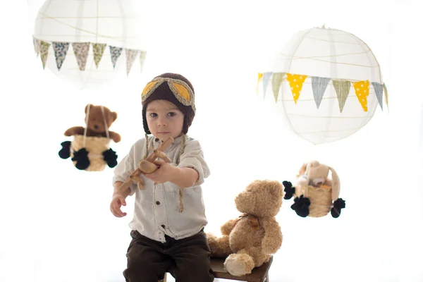 Sweet Toddler Boy Playing Airplane Teddy Bear Decorated Air Balloons — Stok fotoğraf