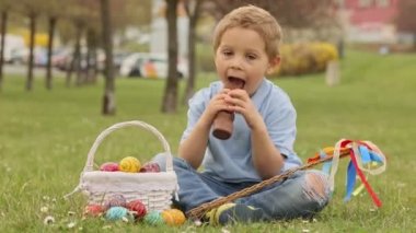 Cute preschool child, whipping his sister on Easter with twig, braided whip made from pussy willow, traditional symbol of Czech Easter used for whipping girls and women