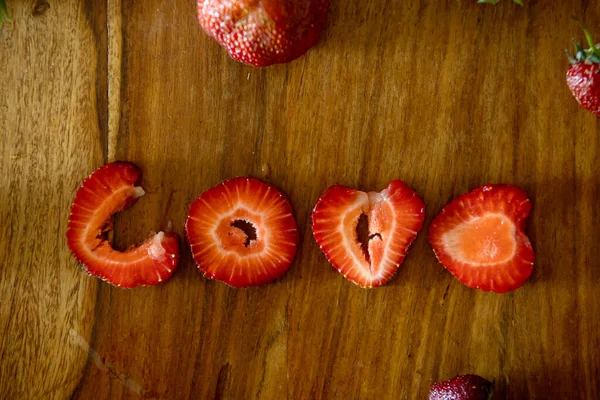 Love Sign Made Strawberry Pieces Table Whote Strawberries — Stock Photo, Image