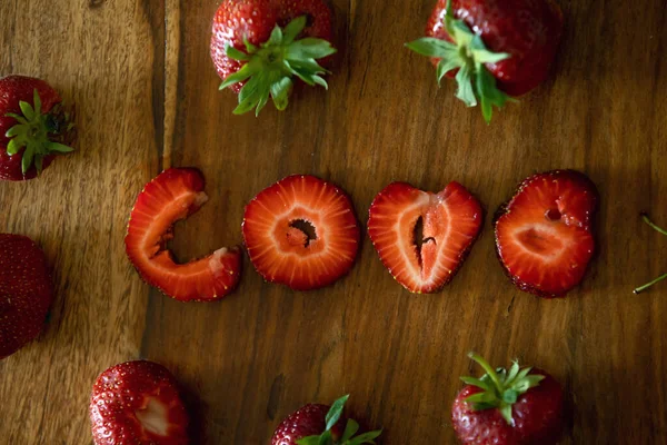 Love Sign Made Strawberry Pieces Table Whote Strawberries — Stock Photo, Image