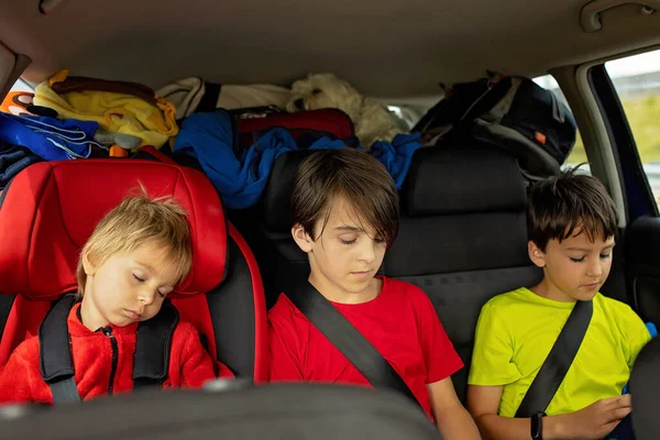 Three Boys Car Seats Traveling Car Sleeping Playing Mobile While — 图库照片