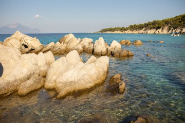 Amazing view of rocks in the Aegean see with Aton peak in the background