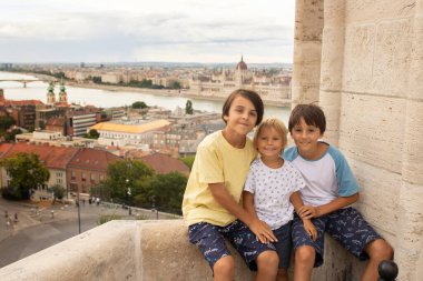 Child, boy, visiting the castle in Budapest on a summer day, Hungary