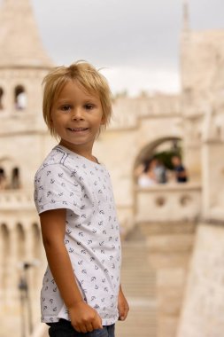 Child, boy, visiting the castle in Budapest on a summer day, Hungary