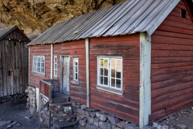Happy people, enjoying amazing views in South Norway coastline, fjords, lakes, beautiful nature. Kids and adults traveling in Norway summertime
