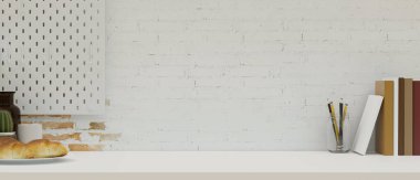 Kitapları, kırtasiyesi, tabağındaki ekmeği ve minimalist beyaz tuğla duvarın üzerinde sergilenecek ürün alanı olan modern çalışma alanını kapatın. 3d görüntüleme, 3d illüstrasyon