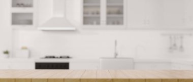 A copy space on wooden dining tabletop over blurred modern luxury white kitchen interior in the background. 3d rendering, 3d illsutration