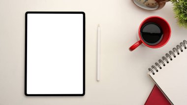 Digital tablet touchpad with blank display screen for your graphic on minimal worktable. top view