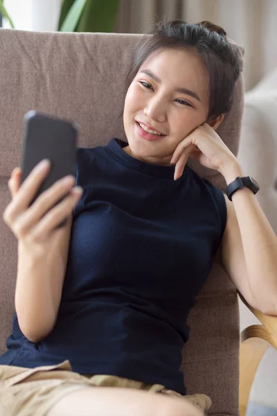 Portrait Beautiful Woman Sits Comfy Armchair Enjoys Watching Online Content — Stock Photo, Image