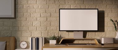 Yakın plan, yatak odasının içinde modern konforlu çalışma alanı bilgisayar boş ekran maketi ve tuğla duvara dayalı modern dekorla. 3d görüntüleme, 3d illüstrasyon
