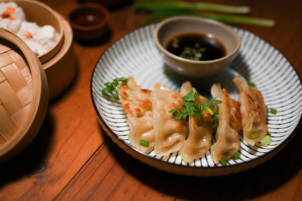 Authentic Chinese cuisine with Traditional homemade fried dumplings or gyoza. Asian food concept .
