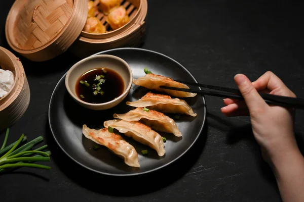 Female Enjoy Eating Asian Fried Gyoza Fried Dumplings Chopsticks Black — Stock Photo, Image