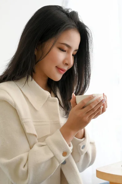 Portrait Pleased Relaxed Woman Smelling Coffee Holding Hot Coffee Cup — Fotografia de Stock