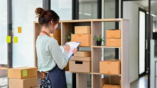 Charming Asian Millennial Woman Fashion Retail Shop Owner Checking Her — Stock Fotó