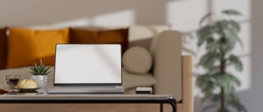 Notebook laptop white screen mockup and accessories on coffee table in comfortable minimal living room interior design. 3d rendering, 3d illustration