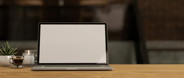 Modern workspace with notebook laptop computer blank screen mockup, accessories and copy space for montage on wooden tabletop over blurred dark background. close-up, 3d rendering, 3d illustration