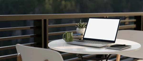 Portable outdoor workplace with portable notebook laptop computer and decor on the table in a balcony of home or restaurant. 3d rendering, 3d illustration