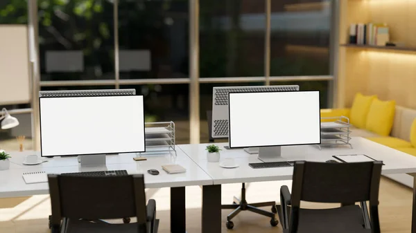 Modern company office studio with PC computer white desktop screen mockup and office supplies on the table, office chairs and decor. 3d rendering, 3d illustration