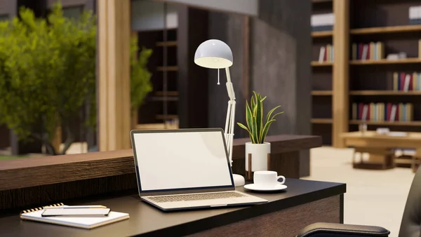 Stylish comfortable home office studio interior design with notebook laptop white screen mockup, coffee cup, table lamp, decor plant and stuff on table, bookcase. 3d rendering, 3d illustration