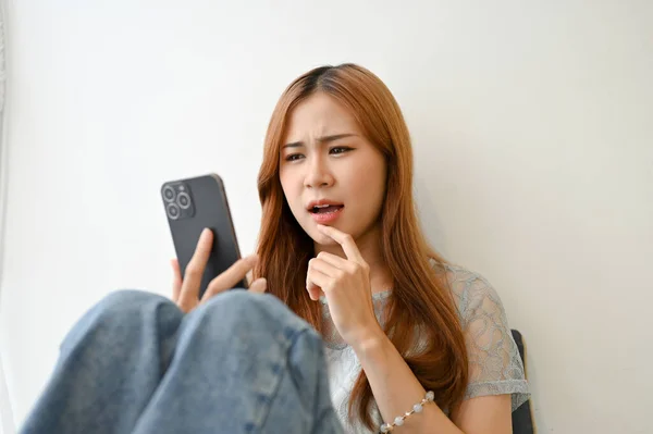 Beautiful Amazed Millennial Asian Woman Using Smartphone Looking Phone Screen — Φωτογραφία Αρχείου