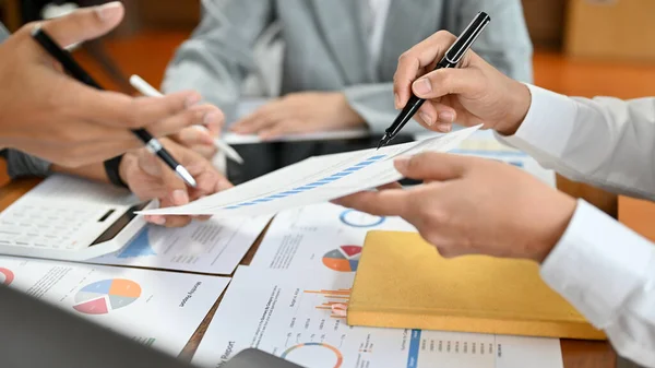 A group of banker or financial consultant working together, brainstorming the financial investment strategy together in the meeting. cropped image